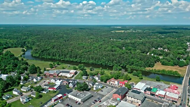Suburban neighborhood house in village. Town in countryside. Aerial landscape. Small town aerial view. Countryside village landscape. Village neighborhood with house. Panoramic view