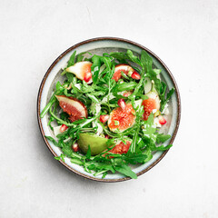 Salad with arugula, figs and cheese, view from above