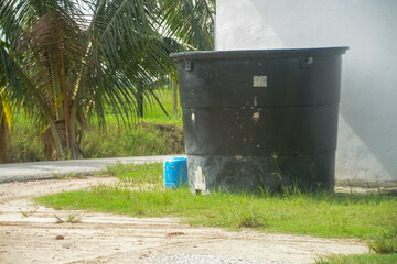 The tank's weathered appearance indicates that it has been in use for some time, providing a reliable source of water for the local community.