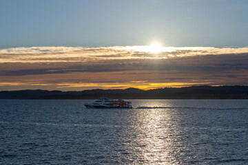 Fototapeta premium Ferry at sunset