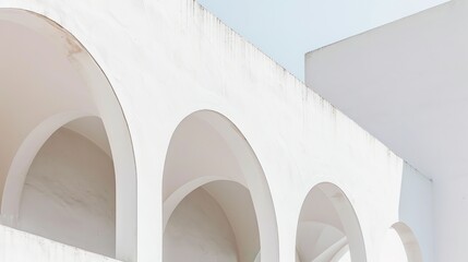 Fototapeta premium White Arched Line Building - an elegant and modern architectural visual. The white arched lines create a captivating and stylish atmosphere.