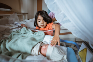 A deeply touching and heartfelt moment unfolds between siblings in a hospital setting