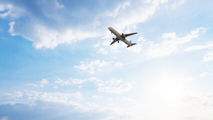 ULTRA HD. Airplane flies in blue sky. Travel. Airplane takes off against the background of blue sky. 