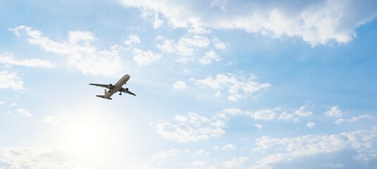 ULTRA HD. Airplane flies in blue sky. Travel. Airplane takes off against the background of blue sky.	