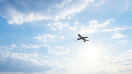 ULTRA HD. Airplane flies in blue sky. Travel. Airplane takes off against the background of blue sky.	
