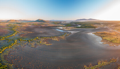 Creek and salt flats with green vegetation in beautiful pattern