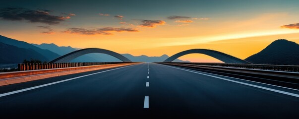 Obraz premium Scenic Highway with Modern Arches at Sunset