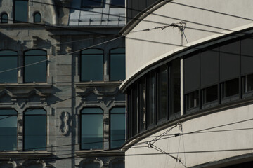 Stone and glass arcs  and therr reflection in dark office buildings in Gronland