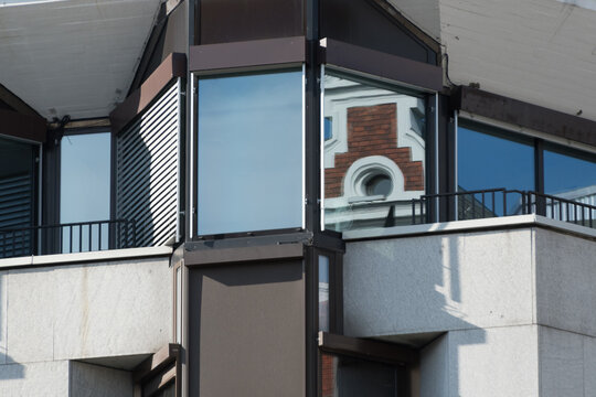 Details of old building exterior reflected in office windows