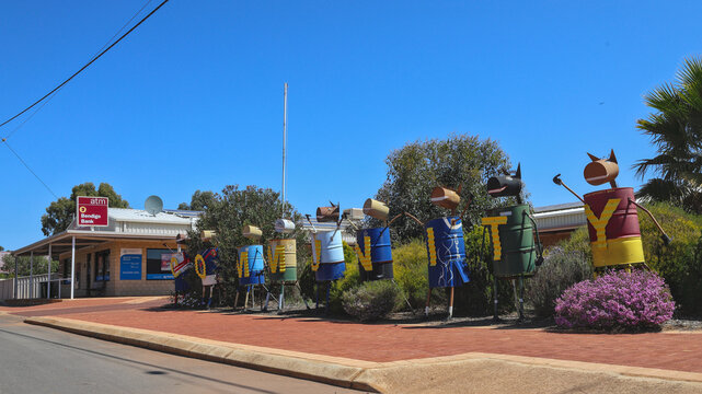 Kulin, Western Australia, Australia - September 23 2024: The word community spelled on tin horses made from empty drums, next to Bendigo Bank. Finance and creativity in the Outback, Wheatbelt region
