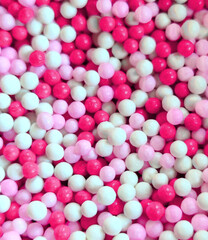 full frame pink white balls Nonpareils candy fun background