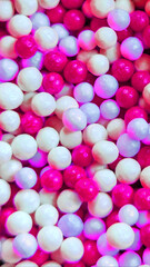full frame pink white balls Nonpareils candy fun background