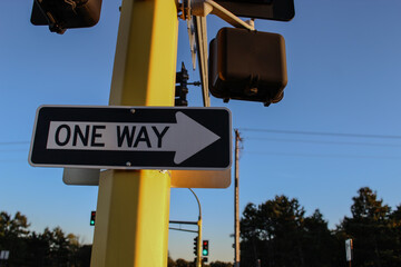 one way street sign on traffic light post metaphor direction decisions future