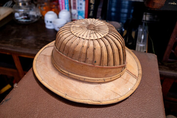 A unique hat made from wood probably used by hunters