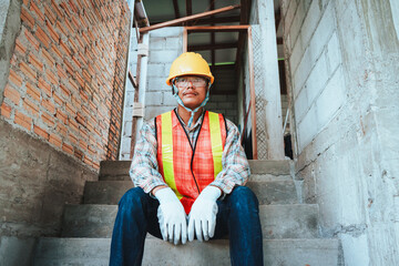 Construction Worker in Safety Gear at a Building Site