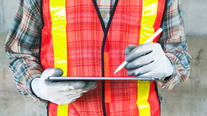 Worker Using Tablet in Construction Environment