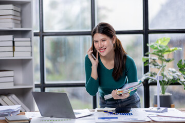 Obraz premium Business woman manager or company worker call phone accounting documents laptop, checking financial data or marketing Accountant report working in the office. 
