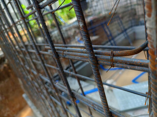 A construction site displaying a reinforced concrete foundation with steel rebar