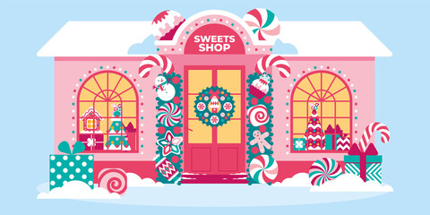 Naklejka premium Beautiful sweet shop in Christmas festive decor with garlands, lights, creative decorations. Showcase of confectionery shop with Christmas sweet souvenirs. Xmas house exterior decoration