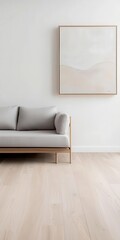 Minimalist loft featuring light wood flooring, a simple grey sofa, and a single piece of abstract art   light wood flooring, grey sofa, abstract art