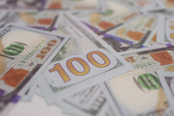 Blue and gold US  dollar banknotes spread out, symbolizing wealth, financial transactions, and global economic value.