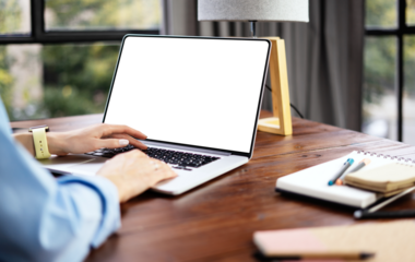 Mockup image of a woman using laptop with blank screen. Transparent. Cut out. PNG