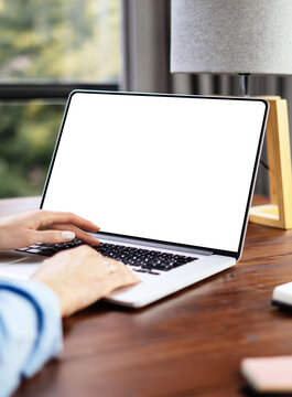Mockup image of a woman using laptop with blank screen. Transparent. Cut out. PNG