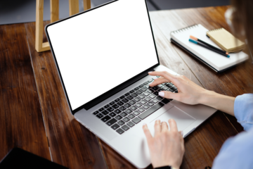 Mockup image of a woman using laptop with blank screen. Transparent. Cut out. PNG