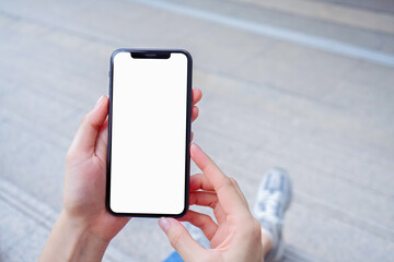 Hand holding smartphone mockup of blank screen, Take your screen to put on advertising.