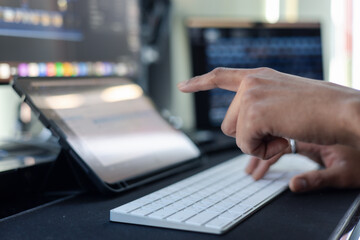 Concept of using technology in communication.Close-up A businessman working on his computer in the office.