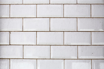 Background from white bricks in a wall