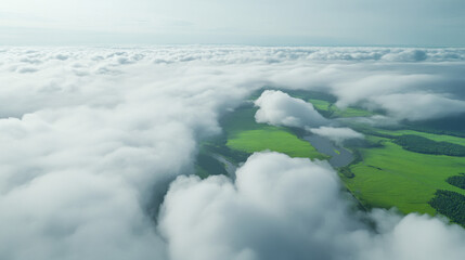 Obraz premium Flying through white clouds revealing green fields and rivers below