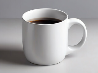 An image of a plain white ceramic mug with coffee on a clean white surface