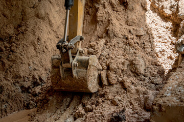 Fototapeta premium A significant pile of ground is being excavated by a bulldozer