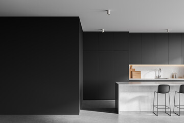 Dark home kitchen interior with bar island and cooking cabinet. Empty wall