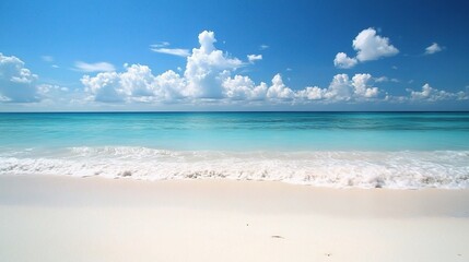 Obraz premium Serene Beach with Clear Blue Water and Cloudy Sky