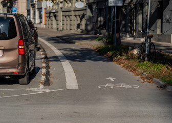 Bicycle lane for bike on asphalt next to a road. Marked bicycle line in Riga, Latvia