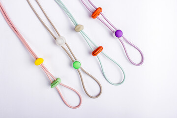 Colorful handmade bracelets with intricate designs displayed on a clean white background. Perfect for showcasing vibrant, artisanal jewelry with a modern, minimalist touch.