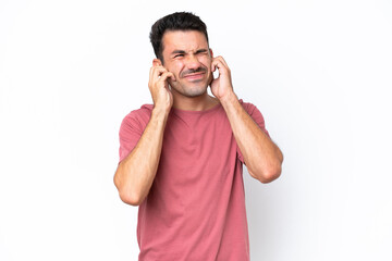 Young handsome man over isolated white background frustrated and covering ears