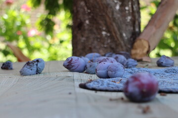 plums on a wooden table