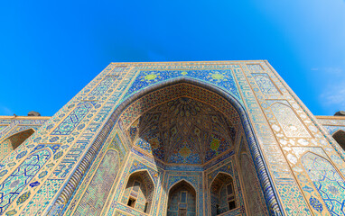 Samarkand, Uzbekistan - October. 10. 2024: Entrance to one of the madrassas on Registan Square
