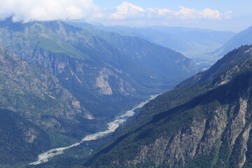 view of the Caucasus Mountains from Mount Mussa Achitara midsummer near the village of Dombay