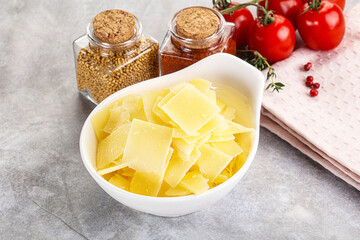 Sliced parmesan cheese in the bowl
