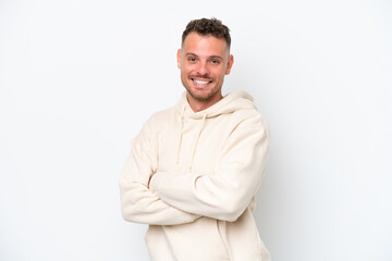 Young caucasian handsome man isolated on white background with arms crossed and looking forward