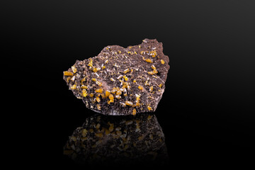 Yellow Mimetite crystals on Dolomite. Specimen from Potosí Mine, Aquiles Serdán, Mexico. photography isolated on black background. macro detail close-up mineral crystal unpolished semi-precious.
