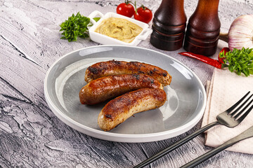 Delicous natural roasted sausages in the plate