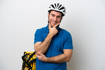 Young caucasian man with thermal backpack isolated on white background smiling