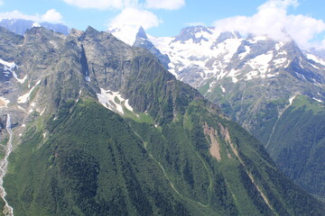 Fototapeta premium mountain peaks of elbrus region in dombai in midsummer