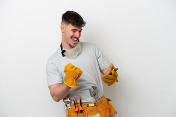 Young caucasian electrician man isolated on white background with phone in victory position