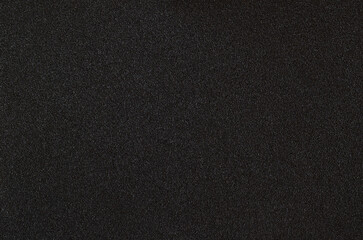 Closeup of black textured plastic surface